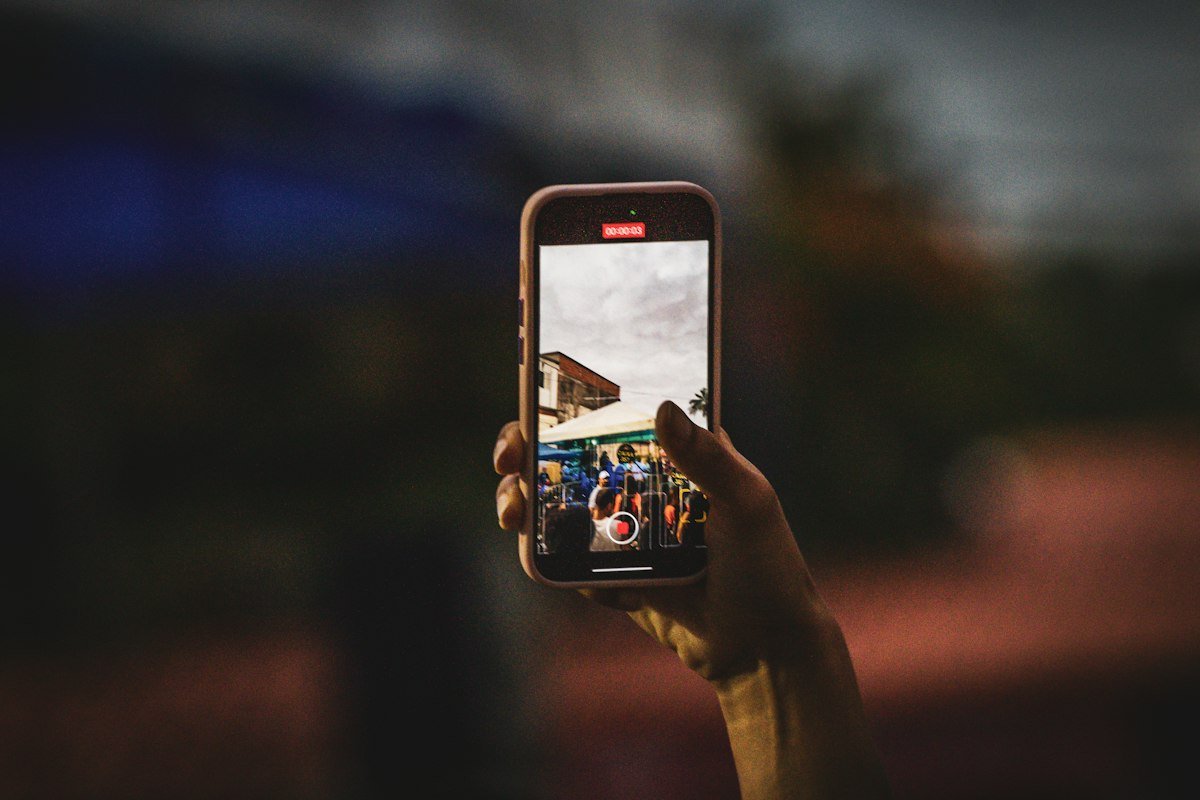 A person taking a picture with a phone