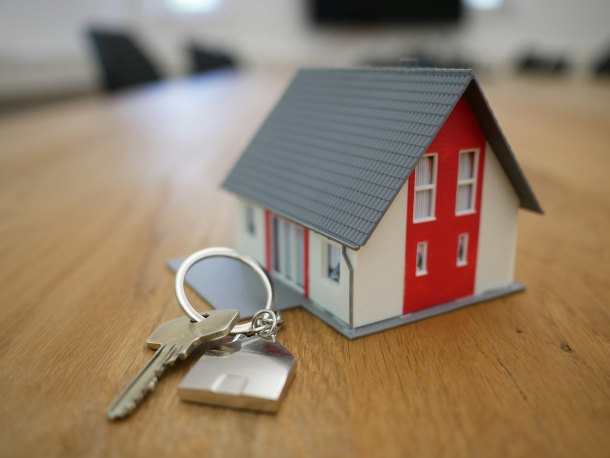 A small model house on a table