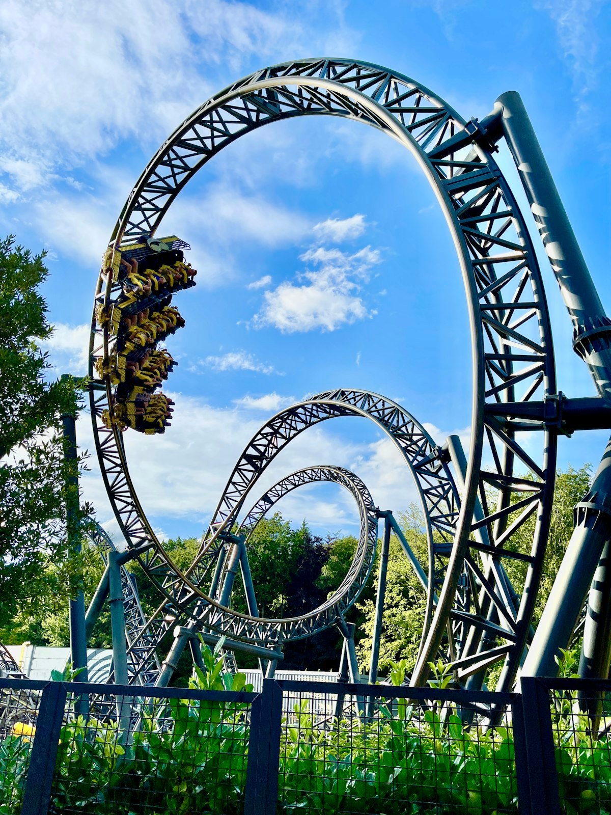 A roller coaster under a blue sky