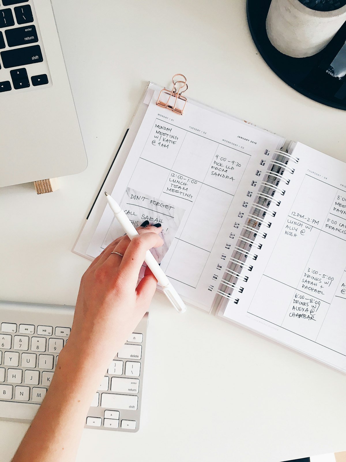 A notepad and pen on a desk, ready for a money plan