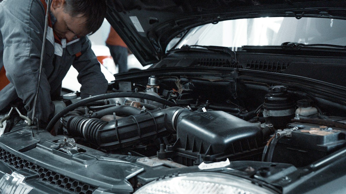A mechanic checking a car engine
