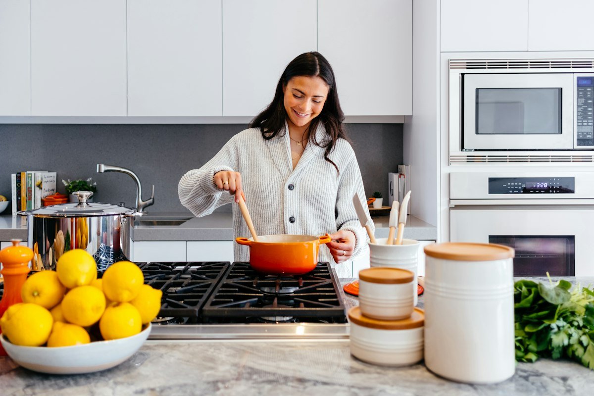 A woman cooking in her kitchen